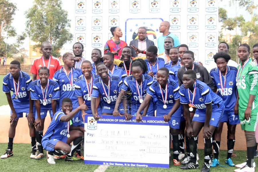 Olila Women FC display their 7M UGX dame check