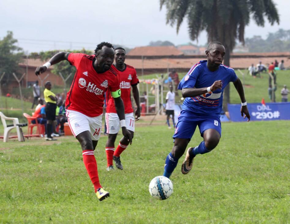 Vipers captain Nicholas Wadada goes past SC Villa's Nicholas Kasozi during their clash on Sunday 27 may 2018 at Muteesa II Stadium Wankulukuku