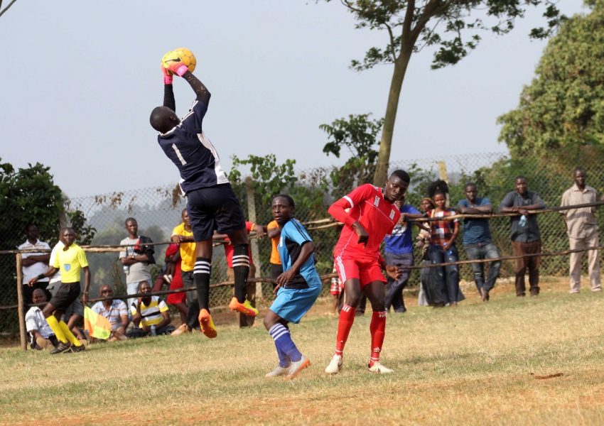 Bukedi's Goalie Wafula Patrick takes charge of the ball at Bishop SS Mukono