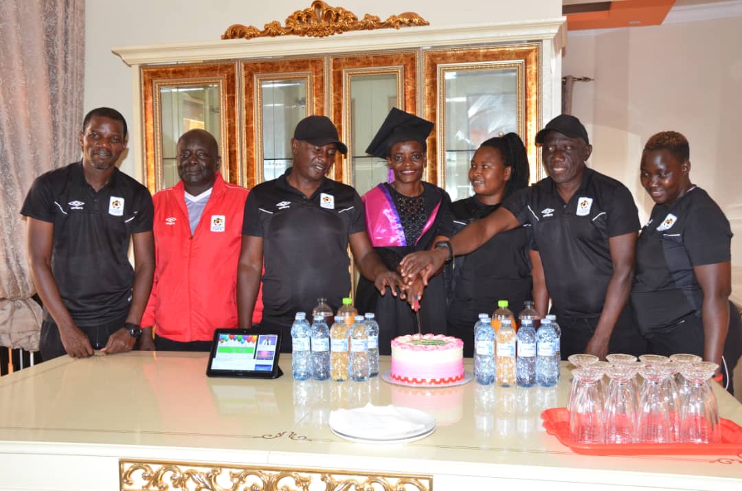 Banura celebrates her graduation in Crested Cranes camp